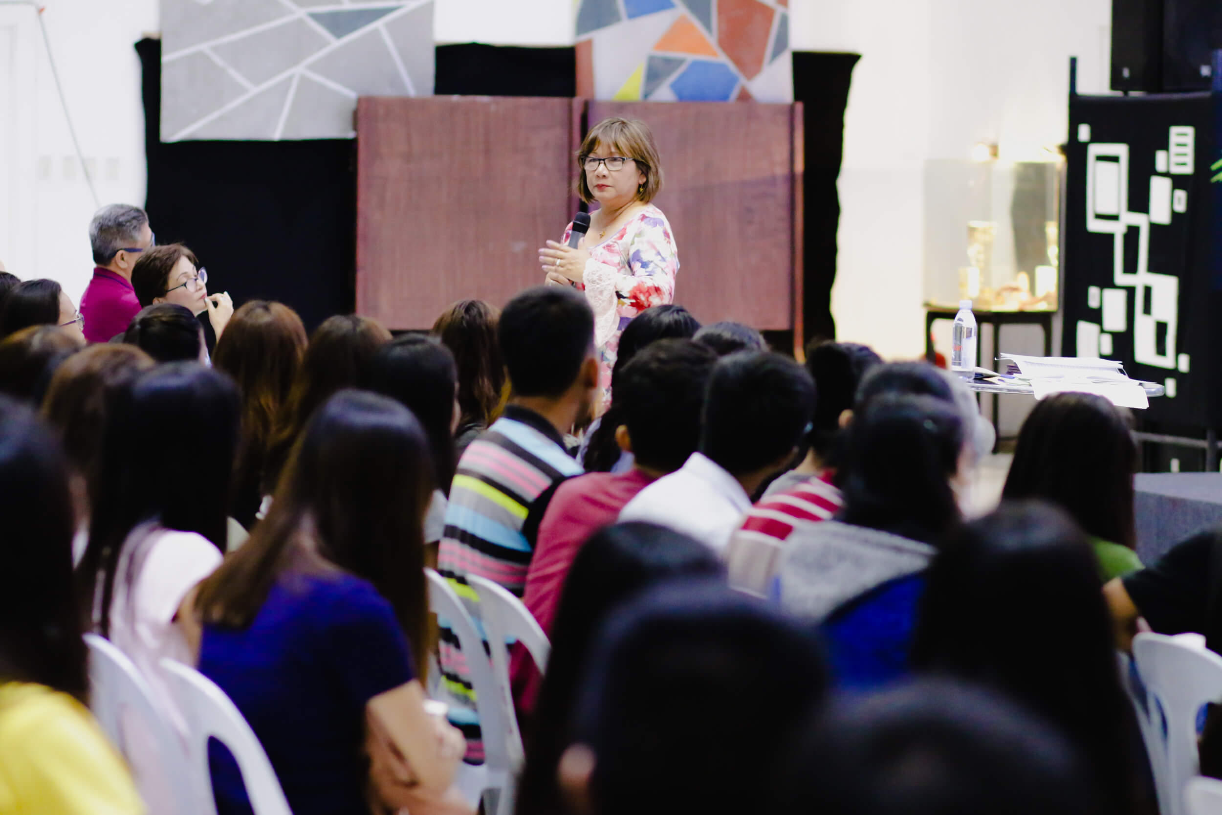 Cristina Sosso speaking before a crowd in General Santos City.
