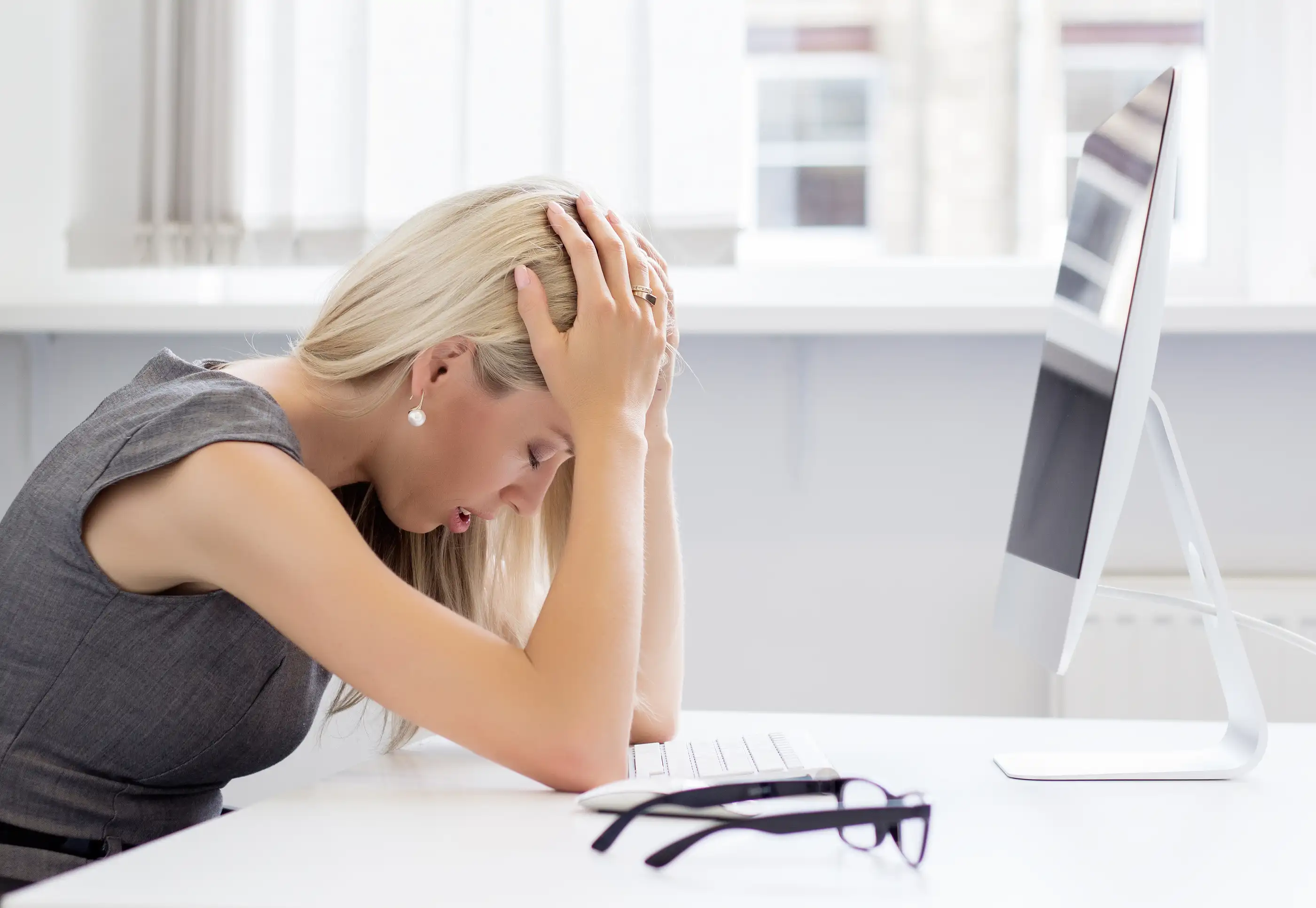 bigstock-Overworked-woman-in-front-of-c-79387945