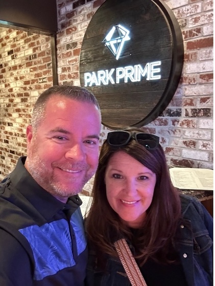 Couple posing in front of Park Prime Steakhouse sign in Lake Tahoe.  
With four children, my priorities have shifted dramatically. I have no desire to squander money on fleeting pleasures like video games, inexpensive toys or other materialistic items that offer temporary gratification.
