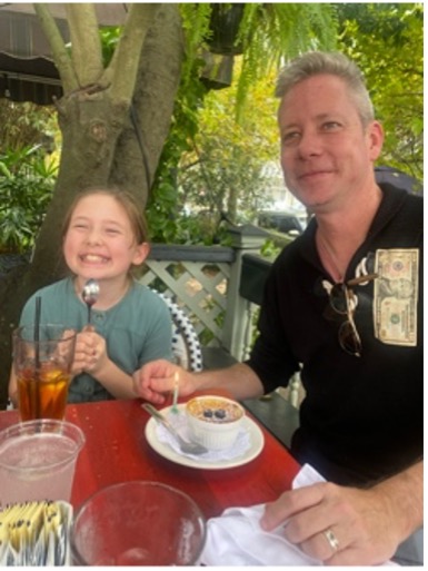 Father and daughter having dinner