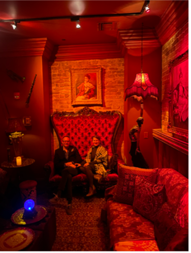 A couple posing in the Seance lounge