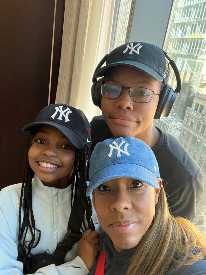 Mother, daughter and son taking a selfie during their New York City stay