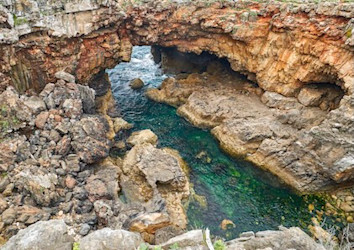 Aerial view of Boca Do Inferno “Hell’s Mouth” sea arch and cliff in Cascais