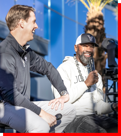Charles Woodson and another panelist hosting an interview
