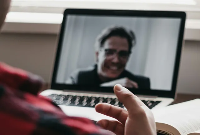 Image of video call with counsellor on laptop