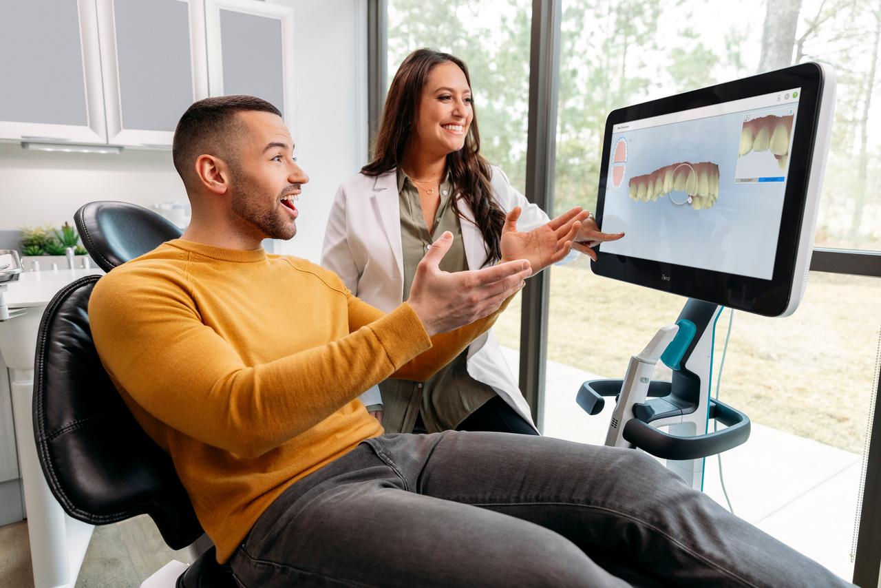 Surprised patient watching at its treatment preview on iTero scanner