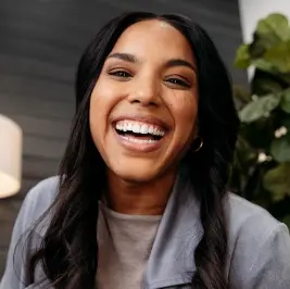 Woman laughing at the camera