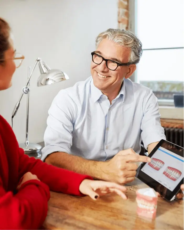 Provider showing digital clinical data to his patient