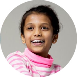 Little girl smiling after successful Invisalign® treatment