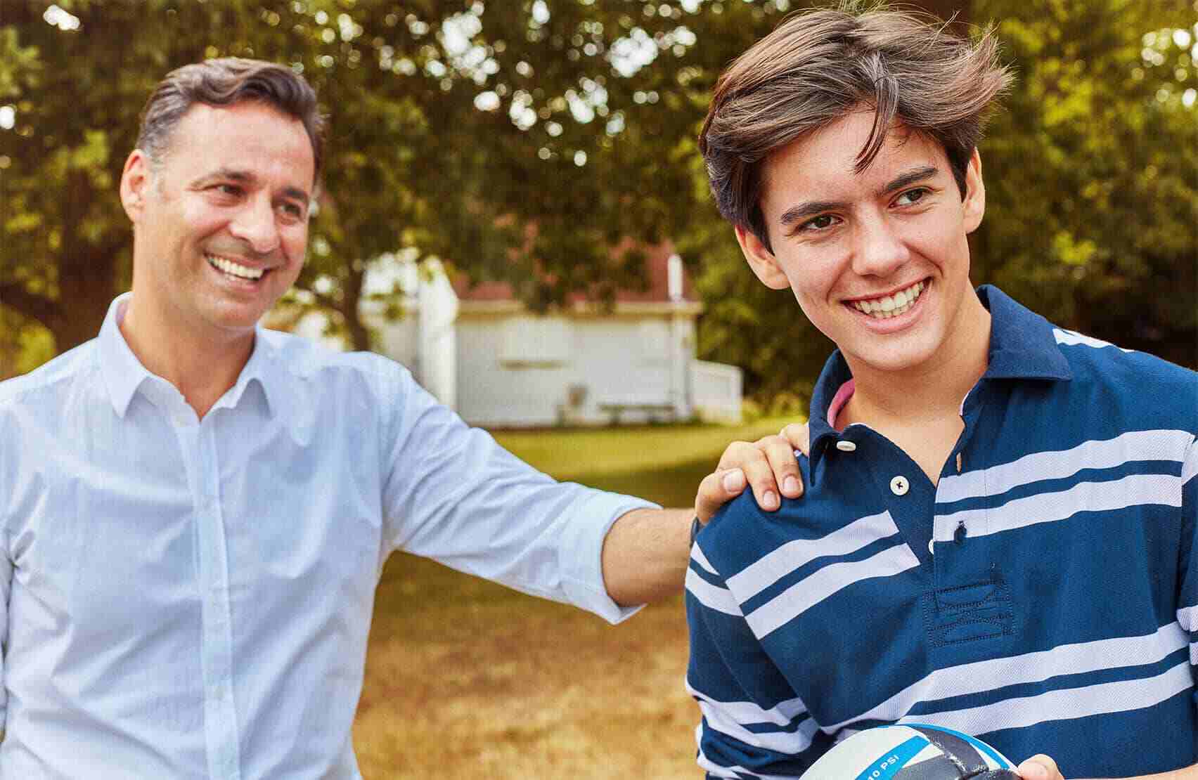 Father and son smiling - Invisalign UK