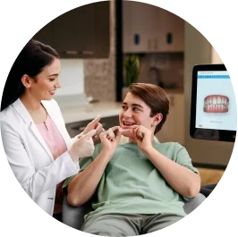 photo-3-up-female-doctor-showing-teen-patient-green-shirt-invisalign