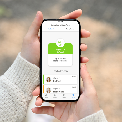 Phone in hands displaying VirtualCare page of Invisalign Mobile App