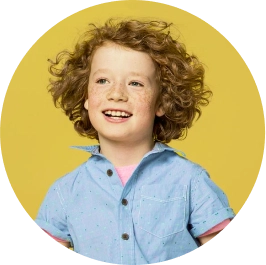 Little boy with red hair smiling