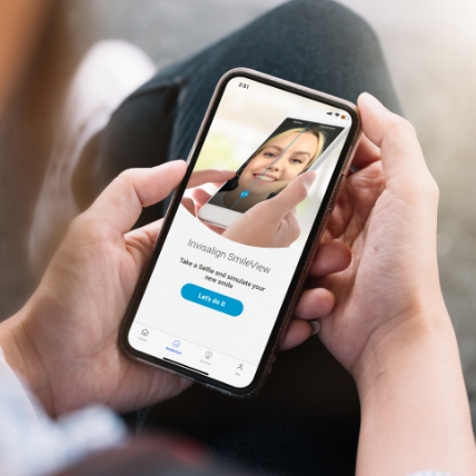 Phone in hands displaying SmileView page of Invisalign Mobile App