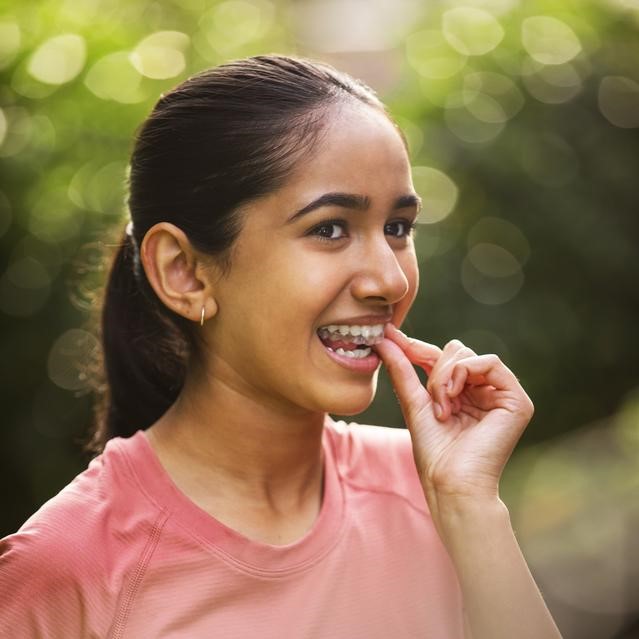 Child wearing her clear aligner - Invisalign UK for parents