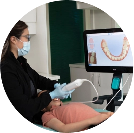 Female doctor using iTero on child patient