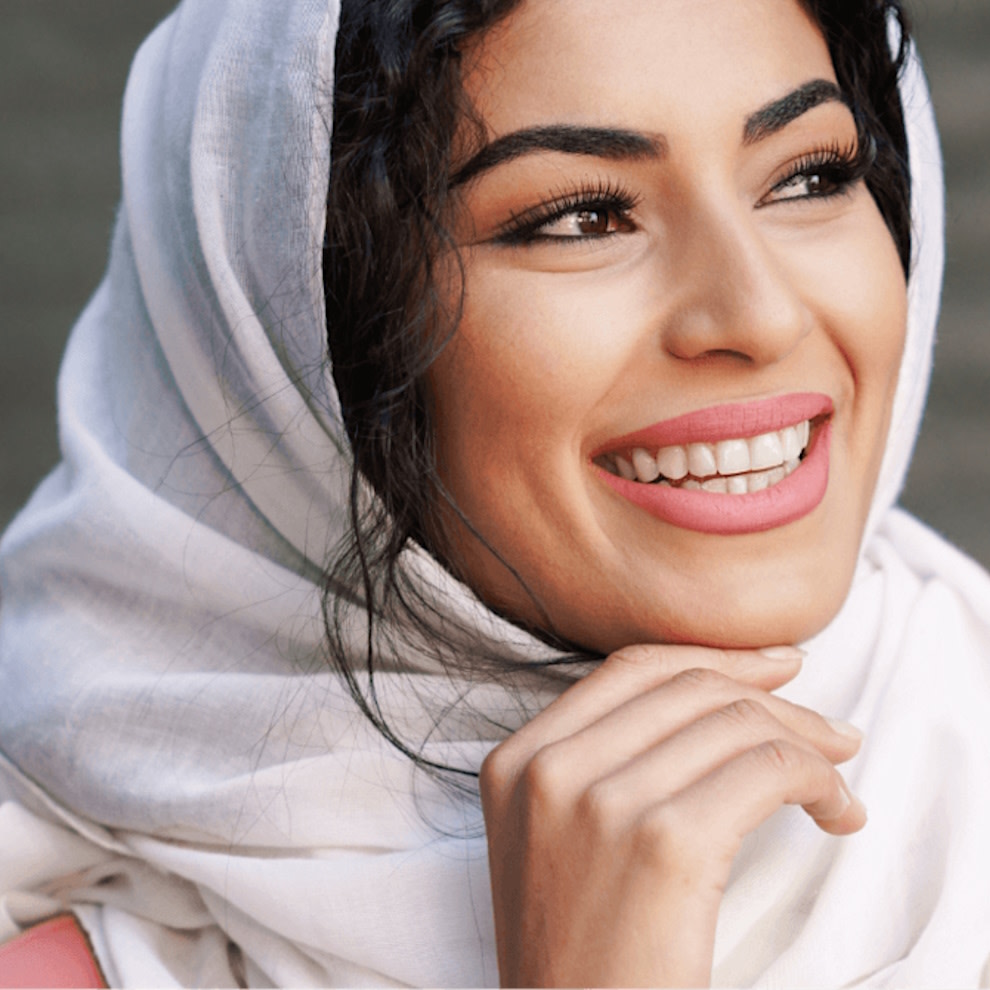 Woman smiling after successful Invisalign® treatment