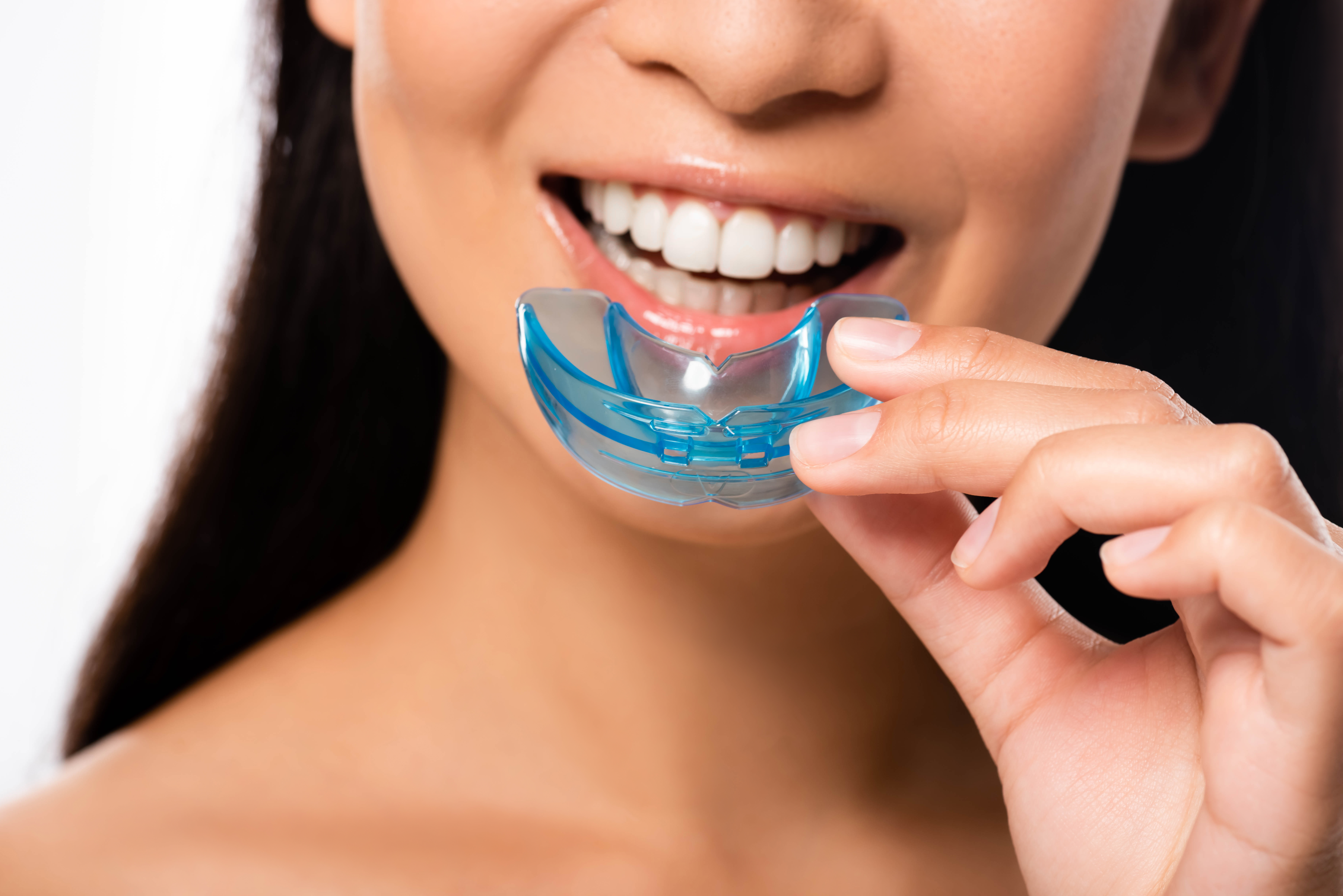 Woman putting in her aligners