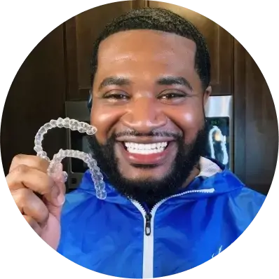 photo-3-up-man-in-blue-jacket-holding-aligners