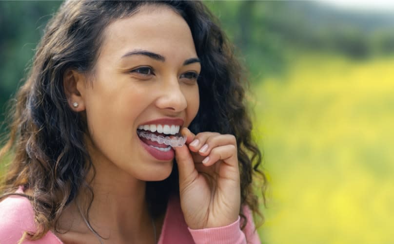 Girl wearing Invisalign clear aligner