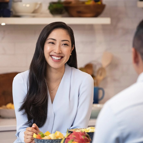 woman smiling in kitchen