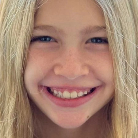 Little blonde girl's smile after her Invisalign® treatment