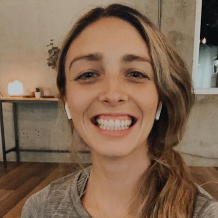 Woman smiling after Invisalign® treatment