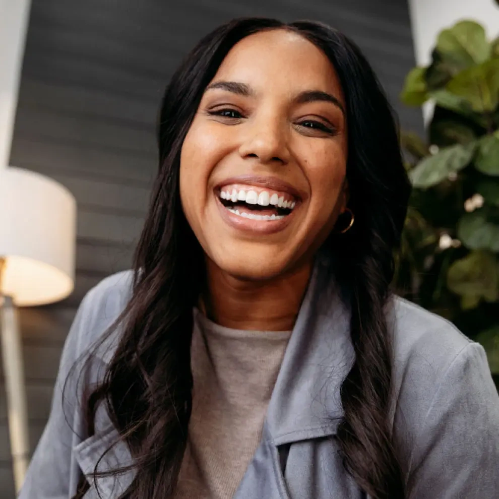 Woman smiling after her Invisalign® treatment