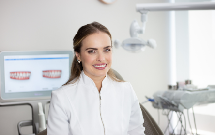 Female Invisalign doctor smiling to the camera