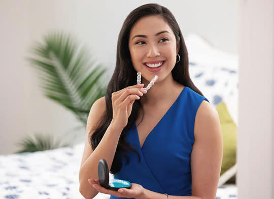 Woman holding Invisalign