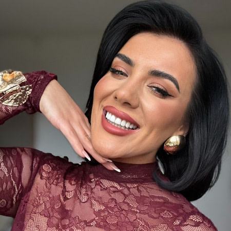 Woman smiling after successful Invisalign® treatment