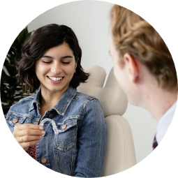 Icon with girl smiling looking at her aligner