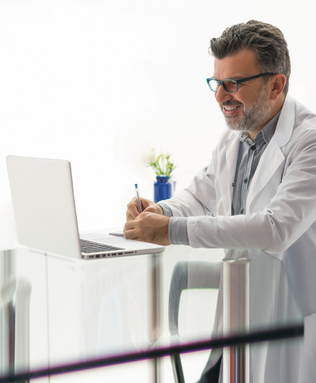 Invisalign doctor looking at laptop