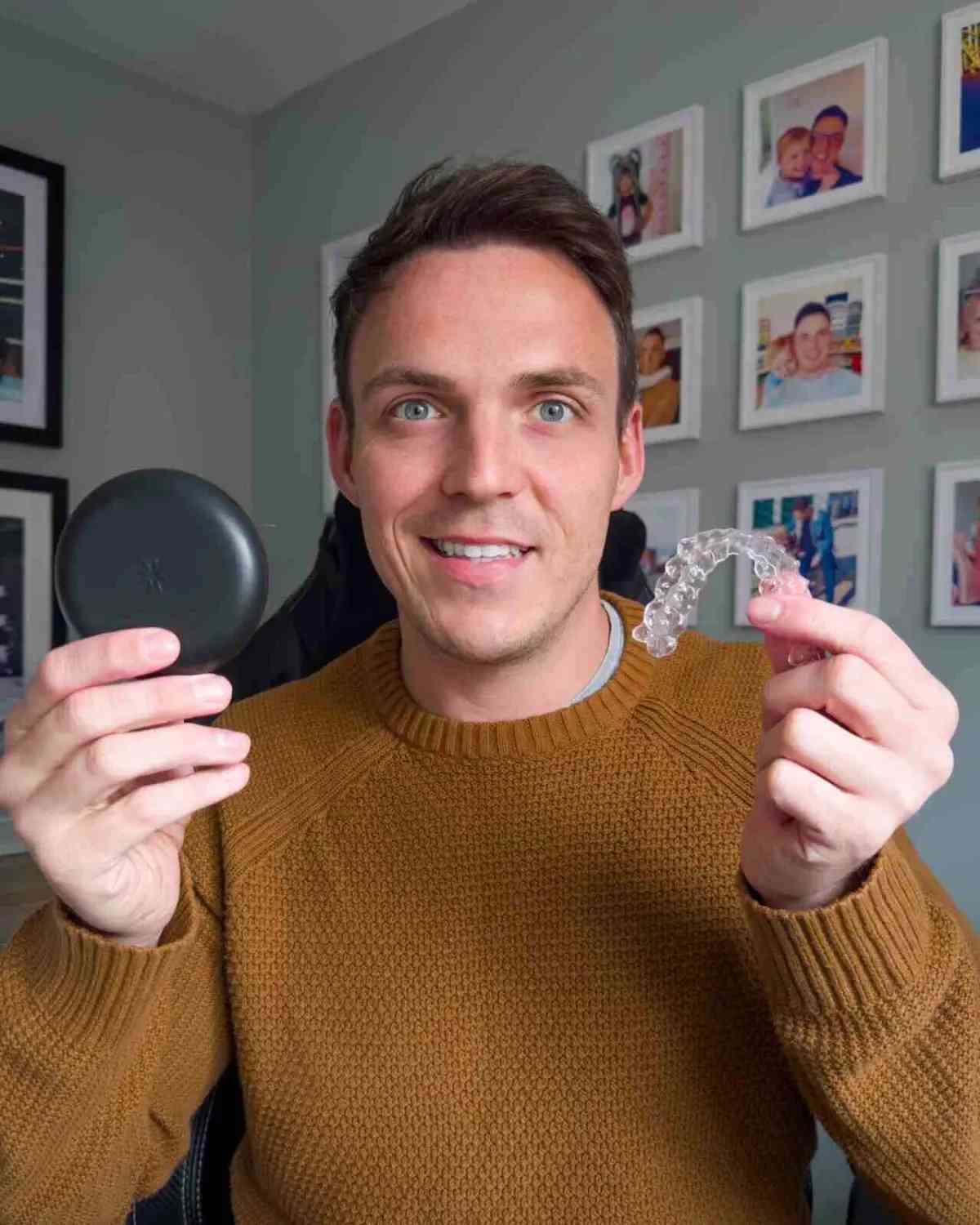 Man holding his clear aligners - Invisalign UK