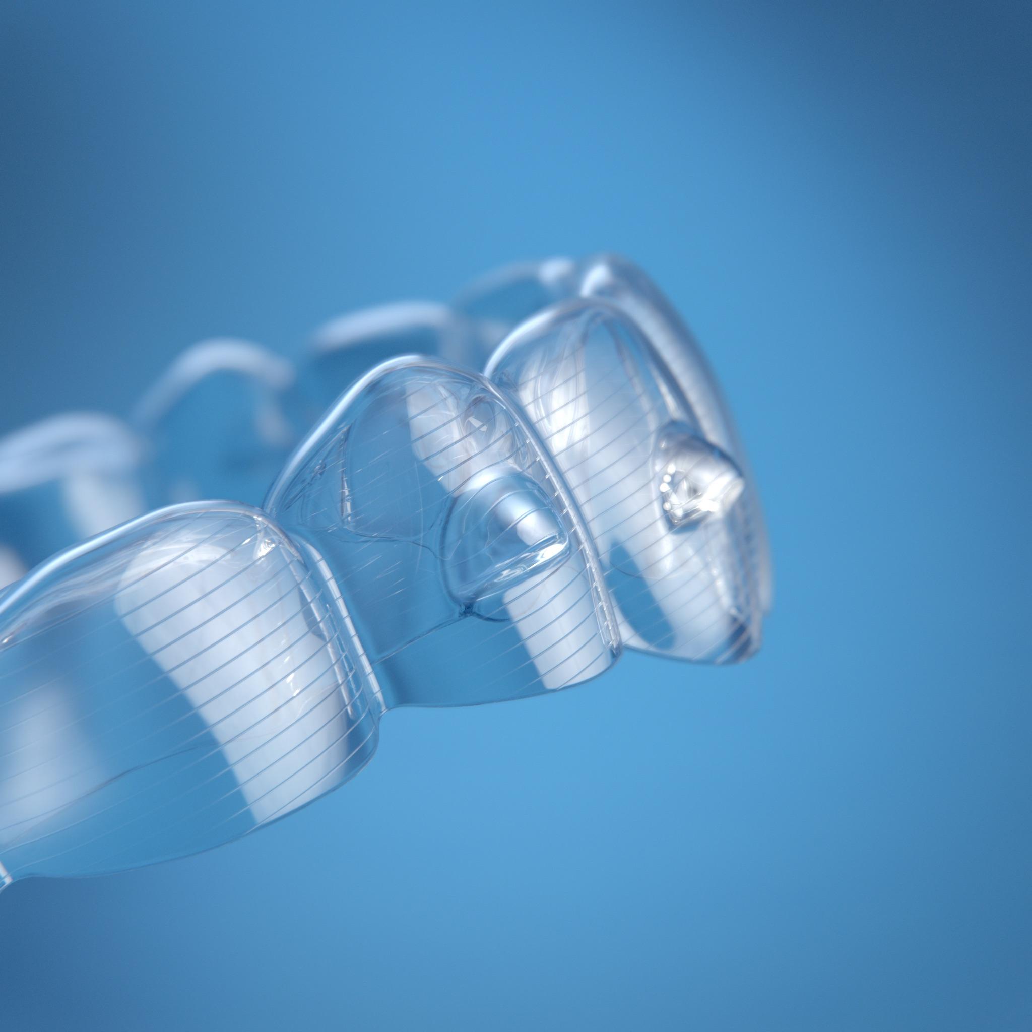 Invisalign aligners on blue background