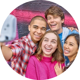 A group of friends smiling after their Invisalign® treatment