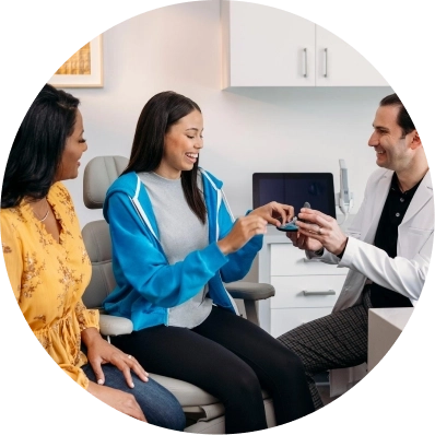 Invisalign® doctor speaking with teen patient and their parent