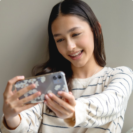 image-text-and-media-girl-looking-at-phone