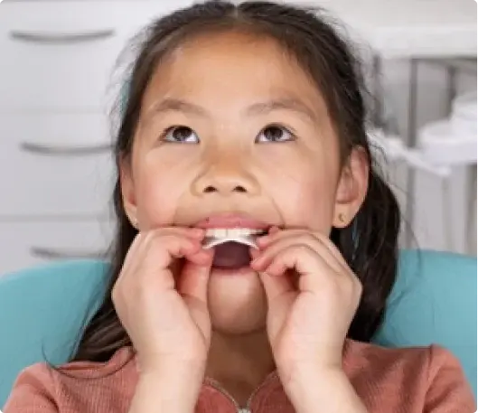 IPE Girl putting Invisalign Palatal Expander