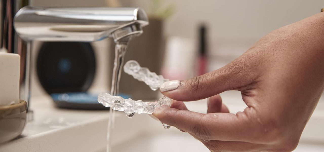 Rinse your Invisalign clear aligners when you take them out