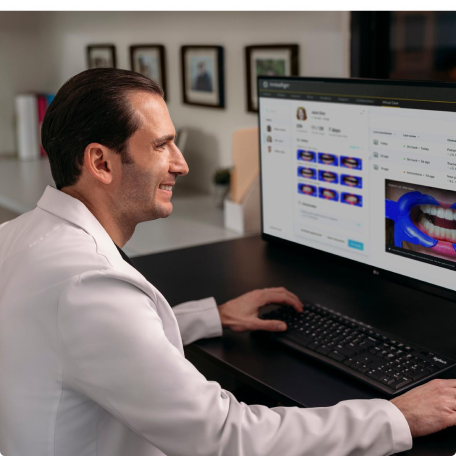 Invisalign doctor using the Invisalign practice app on his computer