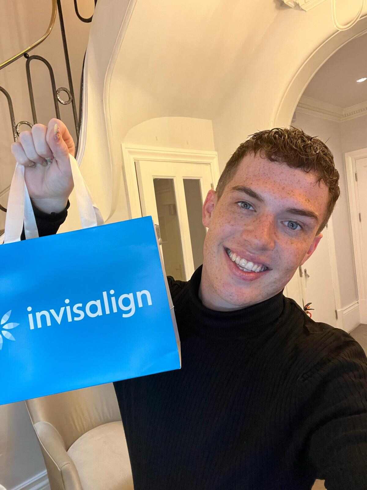 Teen has received his clear aligners in an Invisalign bag