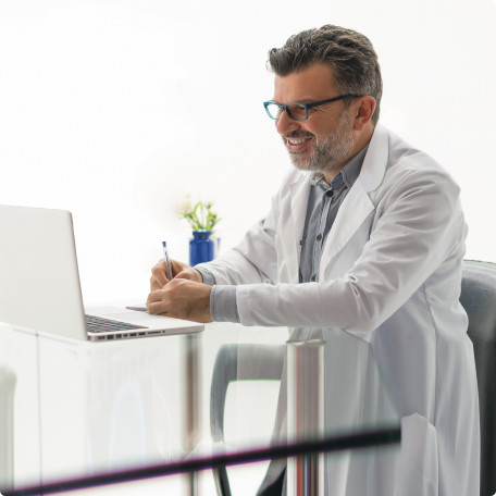 image-text-and-media-doctor-looking-at-laptop