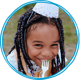 photo-3-up-blue-circle-girl-eating-cake-wearing-party-hat