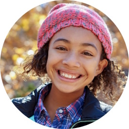 Little girl smiling after successful Invisalign® treatment