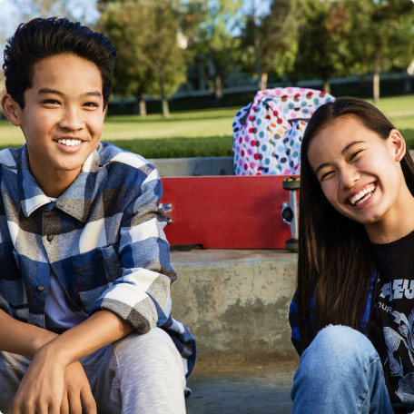 Two teens smiling in a Park