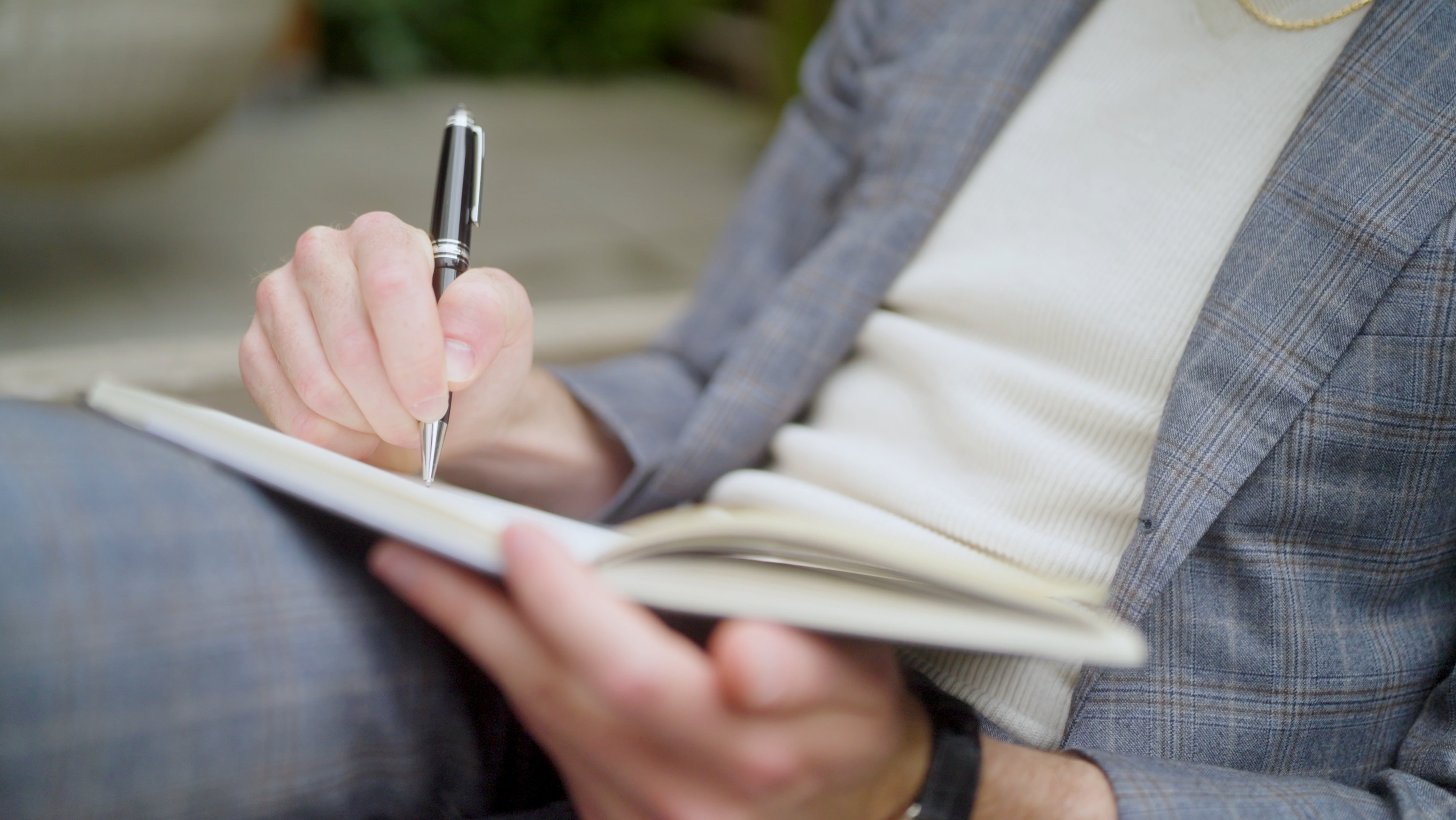 Philip Farr, San Francisco luxury real estate agent, writing notes during a client consultation. From his brand video produced by The Bureau and photographed by Drew Bird Photography.