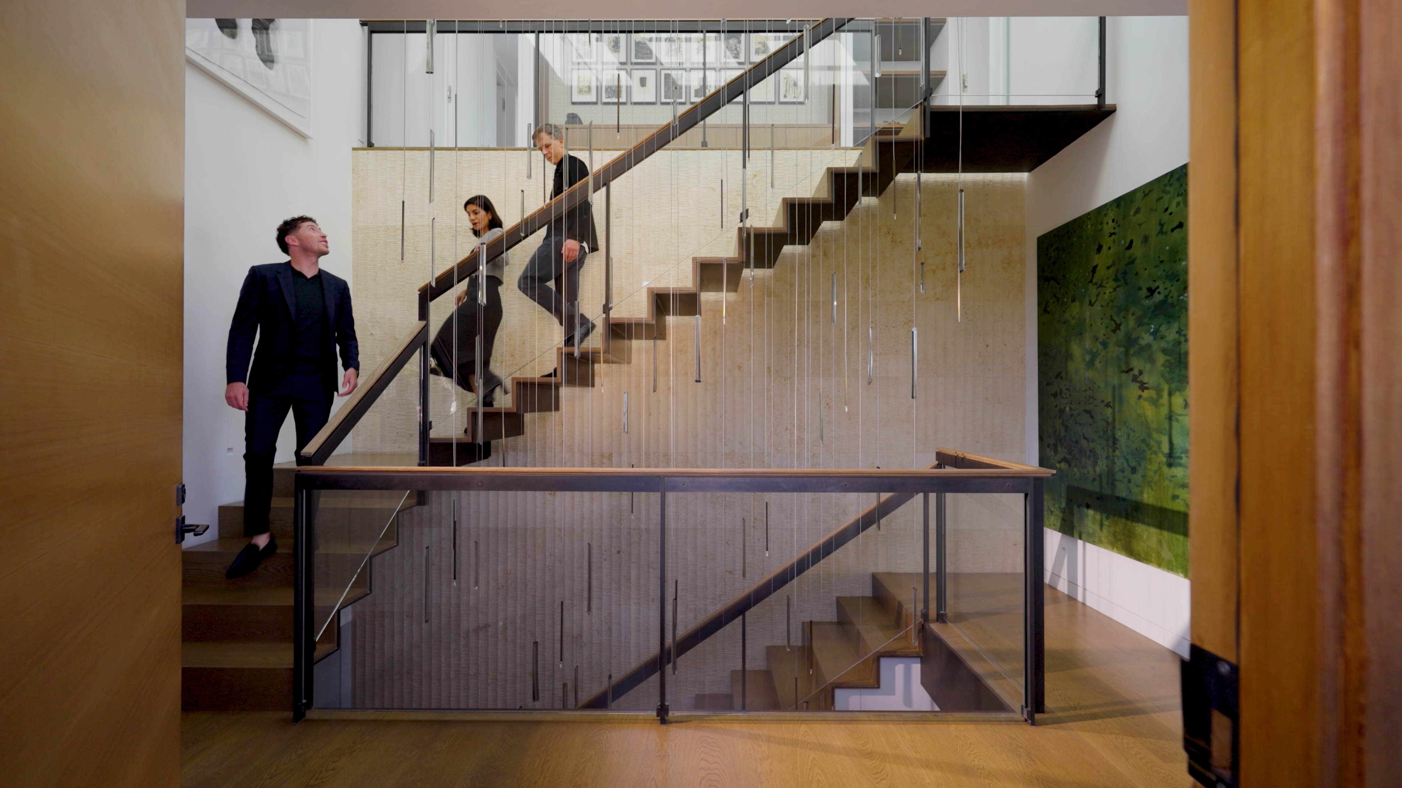 Interior shot of a luxury San Francisco home staircase with modern design, featured in Philip Farr's real estate brand video. Photography and branding by Drew Bird Photography.