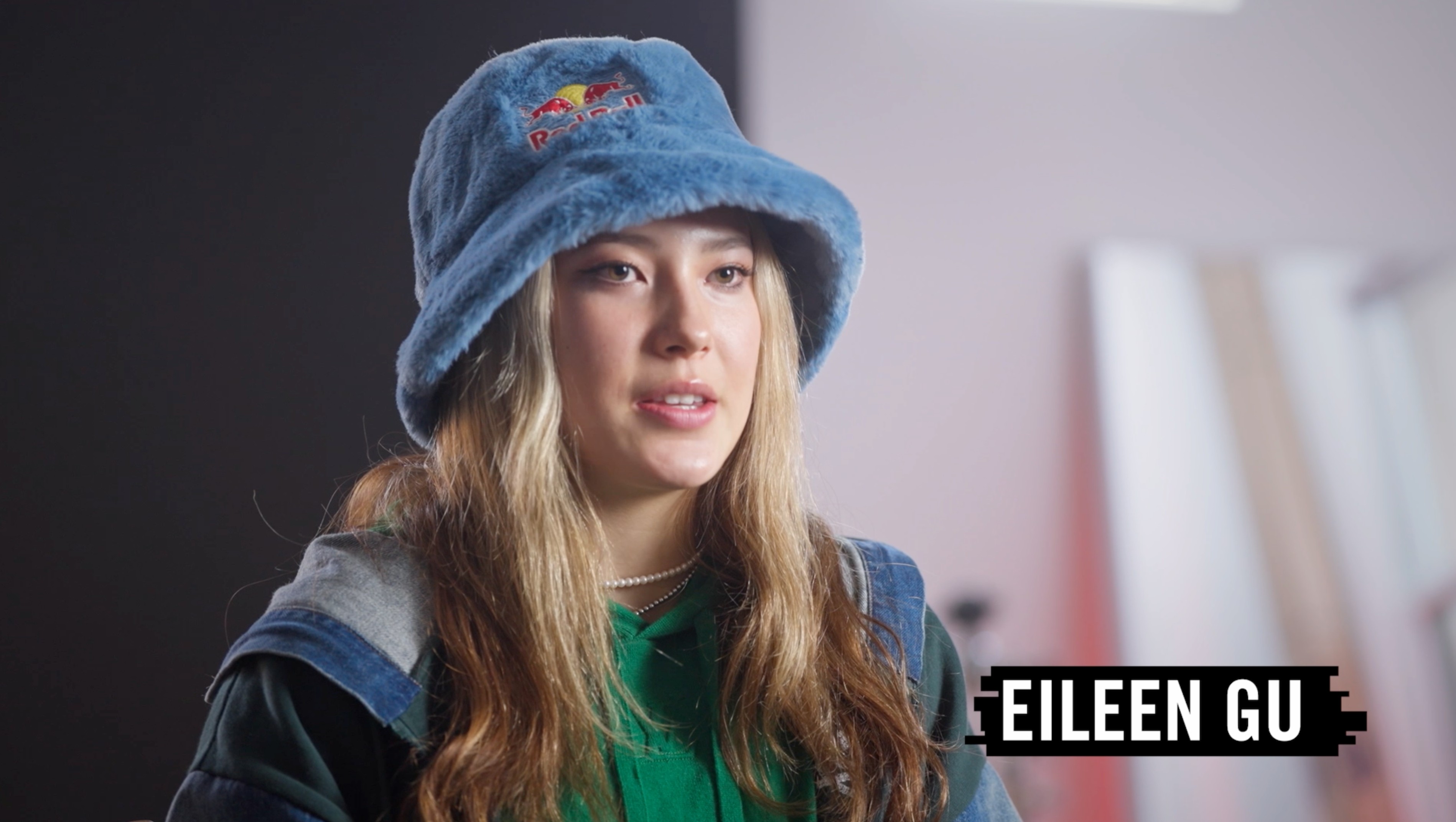 Eileen Gu Red Bull athlete interview portrait, X Games freestyle ski champion wearing Red Bull bucket hat