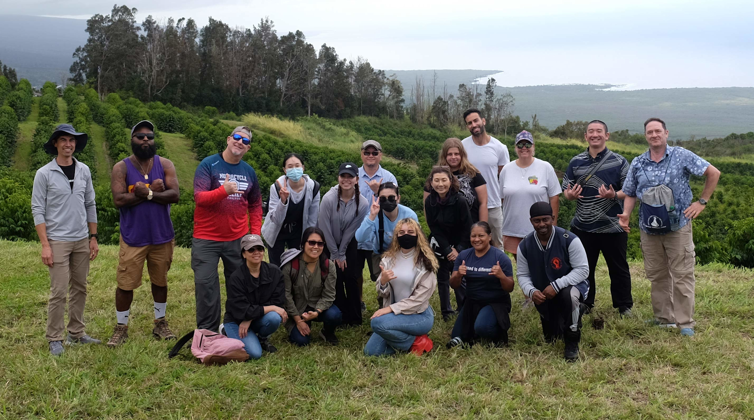 Pono Collective students and teachers pose for a photo on coffee farm